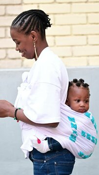 African mother with her baby.Vertical Video.