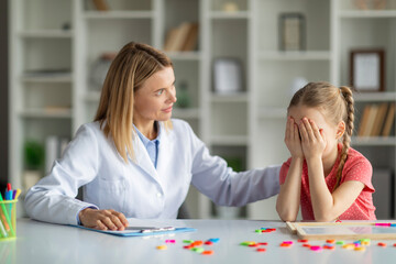 Cognitive Behavior Therapy. Psychotherapist Lady Comforting Crying Female Child