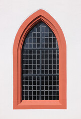 Simple pointed arch of a gothic window at the medieval village church of Boos in Germany