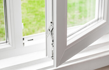 lower part of an open plastic window (PVC plastic)
