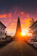 Sunset shining over Hallgrimskirkja church, Lutheran parish church in reykjavik town at Iceland - obrazy, fototapety, plakaty
