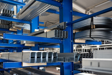 Obraz premium Stock of raw metal materials in a facatory hall (shallow DOF; color toned image)