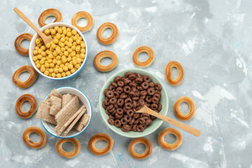 top view cereals and crackers inside plates on the blue background cracker crisp cereal