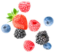 Mix berries. raspberries, strawberries, blackberries and blueberries falling on an isolated on white background