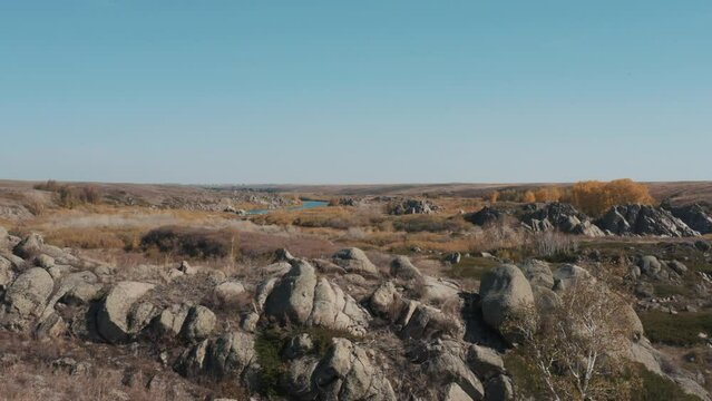 This stock video shows deserted expanses, a winding river, rocky shores. This video will decorate your projects related to nature, weather, rocky rivers, beautiful landscapes.