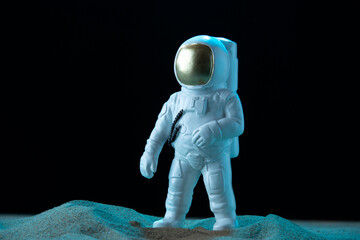 front view of white astronaut on moon dark background cosmic discovery galaxy globe