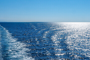 Wake wave that lit by the morning sun. 