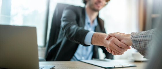 Businessman handshake for teamwork,business merger and acquisition,successful negotiate,job...