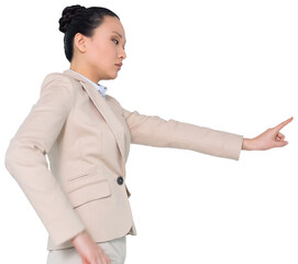 Digital png photo of serious asian businesswoman pointing with finger on transparent background