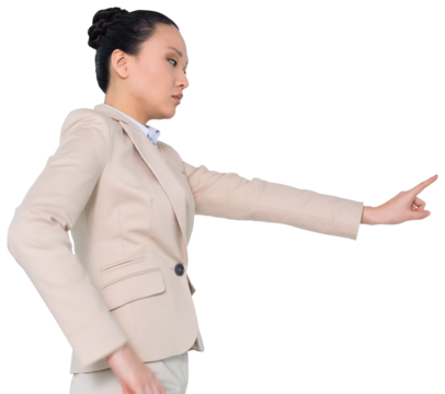 Digital png photo of serious asian businesswoman pointing with finger on transparent background