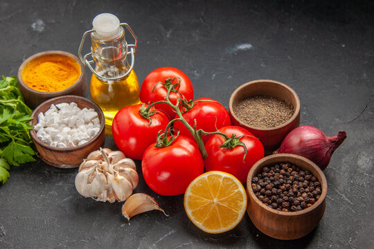 front view fresh red tomatoes with greens and seasonings on dark background ripe salad green pepper photo fod meal health diet