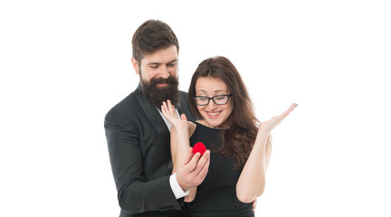 Can not believe this is happening. marry me. offer her engagement ring for marriage proposal. celebrate special occasion. tuxedo man and elegant girl. happy valentines day. formal couple in love