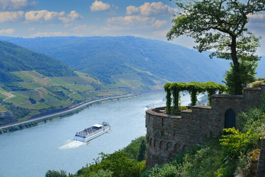 Sooneck Castle, Ferry cruising, white tourist ship on river rhine in valley among luxurious vineyards, in Rhineland-Palatinate, wine tourism, romantic cruise on Rhine and Moselle, coastal destination