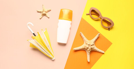 Different beach accessories on color background, top view