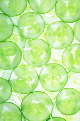 macro sliced cucumber,Two fresh cucumbers on the background,fresh cucumber slices background