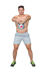 Digital png photo of caucasian sportsman lifting kettlebell on transparent background