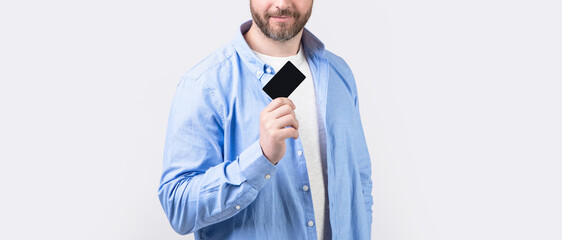 guy show business card isolated on studio background, cropped view. guy with business card in...
