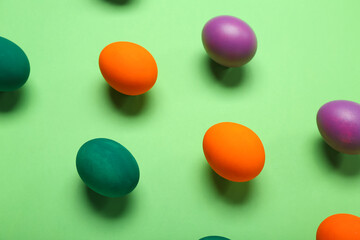 Painted Easter eggs on green background