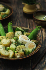 A bowl with farming summer salad in rustic style