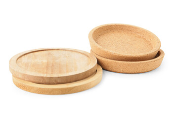 Wooden kitchen boards and cork plates on white background