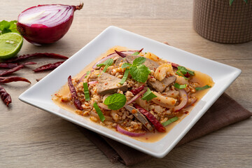 Spicy minced pork salad ,Laab moo ,Mixed Pork with boiled skin and liver in spicy lime sauce