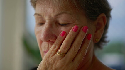 Worried senior woman contemplating problem in deep thought. An older caucasian older lady pondering...