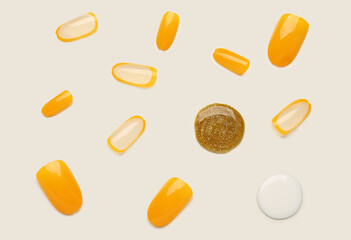 Press-on nails with polishes on white background