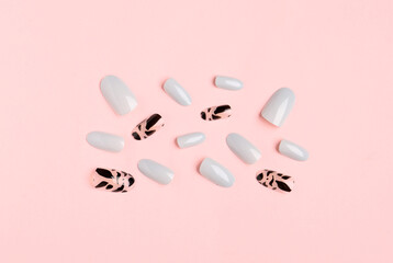 Press-on nails on pink background