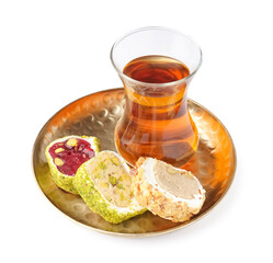 Plate with tasty Turkish Delight and glass of tea isolated on white background