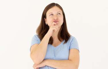 Portrait of standing with thoughtful serious smart expression, pondering answer, having doubts and suspicion, wearing blue T-shirt pregnant woman. Indoor studio shot isolated on white background.