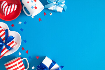 4th of July, USA Presidents Day, Independence Day, US election concept. Gift striped box with bow, cup in stars, plate, star confetti on blue background. Flat lay, top view, copy space