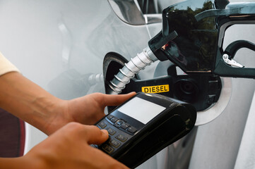 Bank pos ready to pay for a car fuel refueling