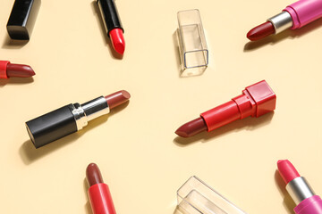 Obraz premium Different lipsticks on yellow background, closeup