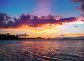 Fototapeta premium Stunning colorful sunset sky with clouds on the horizon of the South Pacific Ocean. Generative AI