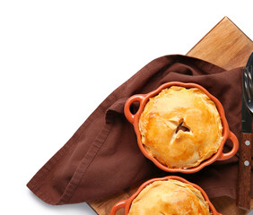 Wooden board with tasty meat pot pies on white background © Pixel-Shot