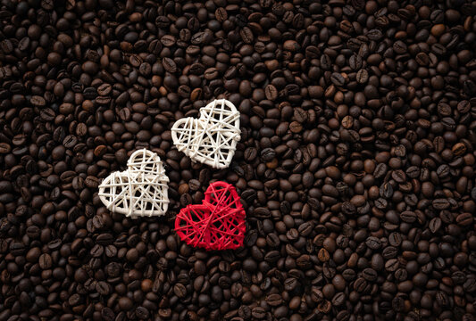 Coffee day concept image, Beautiful image of coffee beans with red and white heart shape, Coffee lover background with copy space