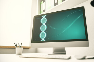 Modern computer monitor with creative DNA hologram. Bio Engineering and DNA Research concept. 3D...