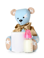 Teddy bear with bottle of milk for baby isolated on white background