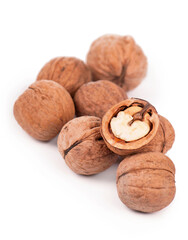 . Fresh ripe Walnut with dried leaves isolated on a white background.