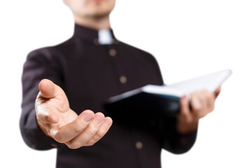 Young priest reading the Holy Bible and stretching his hand, cut out