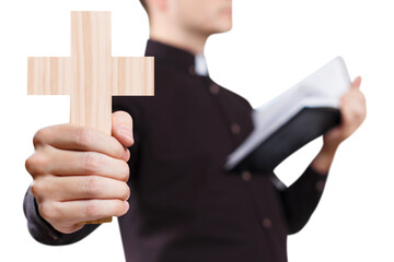 Young priest reading the Holy Bible and holding a cross, cut out