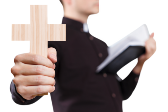 Young priest reading the Holy Bible and holding a cross, cut out
