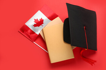 Flag of Canada with graduation hat and books on red background