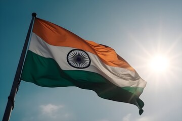 Flag of India waving in the wind against a blue sky - obrazy, fototapety, plakaty