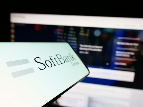 Stuttgart, Germany - 06-16-2023: Mobile phone with logo of Japanese investment company SoftBank Group Corp. on screen in front of business website. Focus on left of phone display.