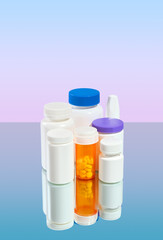 White and orange pill jars on the table. Assorted pharmaceutical medicine pills, tablets and capsules. Copy space.