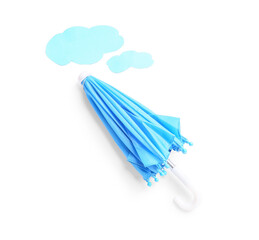 Creative composition with umbrella and paper clouds on white background