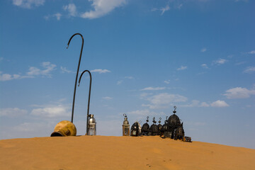 Amazing old metal lamp on the dune. Vintage in the berbers camping