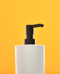 White soap dispenser for hand and body wash. Cleanliness and health.