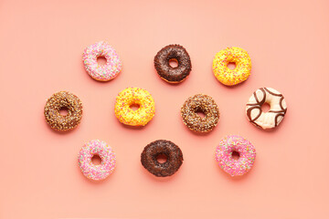 Fototapeta na wymiar Sweet donuts on pink background